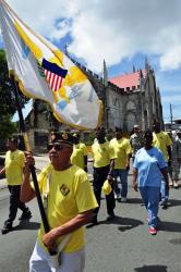 Legionnaire and Vietnam War Veteran Antonio Martinez Jr. carries a flag while walking through downtown Christiansted in honor of 9/11 victims. Legionnaire and Vietnam War Veteran Antonio Martinez Jr. carries a flag while walking through downtown Christiansted in honor of 9/11 victims.